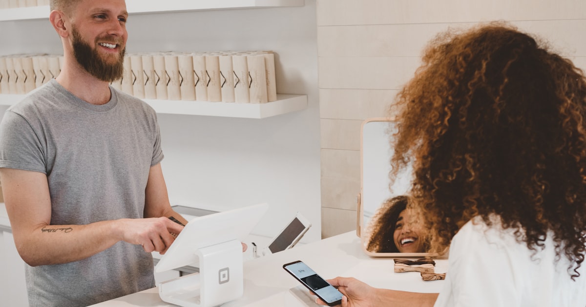 Person checking smartphone with ecommerce purchase notification